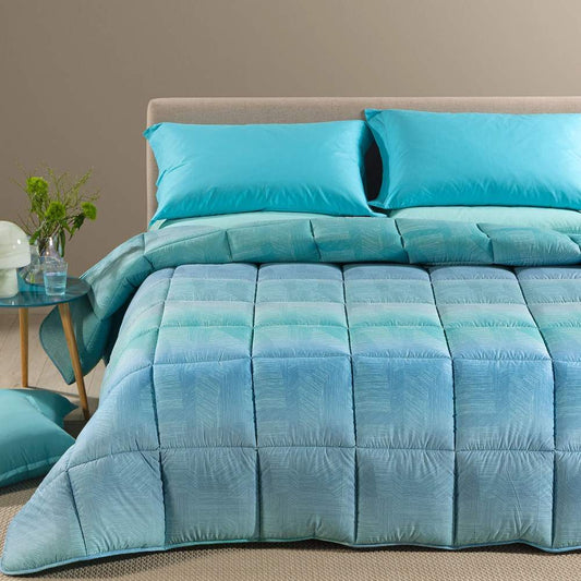 Trapunta invernale Atlantis Caleffi. Piumone fantasia geometrica variante azzurro avio