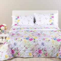 Trapuntino Garden Caleffi. Fantasia vivace con fiori rosa e gialli su fondo chiaro.