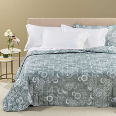 trapuntino riflessi caleffi, colore verde giada. fantasia astratta con fiori stilizzati su fondo verde giada.