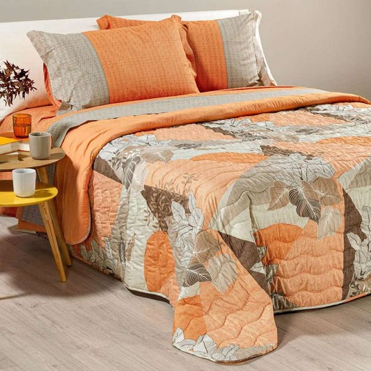 Trapunta primaverile Caleffi Rick in microfibra, per letto matrimoniale. La trapunta primaverile Rick presenta una fantasia moderna che è un interessante mix tra geometrico e floreale. Colore ambra arancione