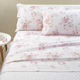 Completo lenzuola matrimoniale Caleffi Floreale in percalle di puro cotone. Fantasia floreale con fiori rosa su fondo chiaro.
