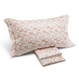 Completo lenzuola Caleffi Oxford in puro cotone per letto matrimoniale. Fantasia moderna geometrica colore corallo