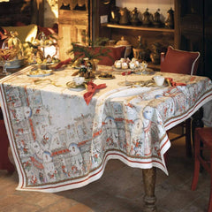 Tovaglia natalizia Christmas Shopping in puro lino di Tessitura Toscana Telerie.   Fantasia su fondo chiaro, con scene di shopping natalizio originali e piene di dettagli. Queste scene fanno respirare aria di festa e richiamano vari elementi tipici del Natale, come gli abeti addobbati, Babbo Natale, i negozi illuminati e le ghirlande.  Misura rettangolare x12 (170x270 cm).