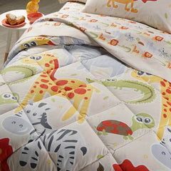 Trapunta invernale Caleffi Giungla in puro cotone per letto singolo. Fantasia con simpatici animali (leone, zebra, elefante, giraffa) su fondo beige