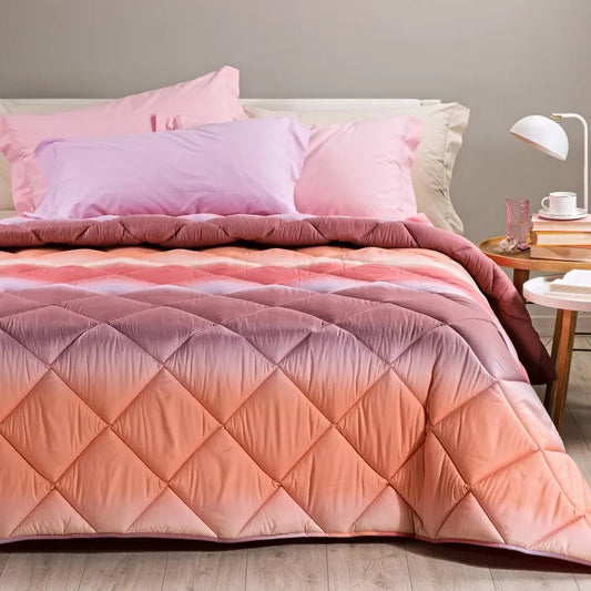 Trapunta invernale Caleffi Aurora in microfibra, per letto singolo. Fantasia sfumata degradè colore corallo rosa