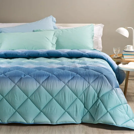 Trapunta invernale Caleffi Aurora in microfibra, per letto singolo. Fantasia sfumata degradè colore azzurro verde