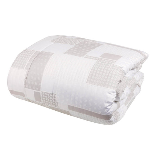 Trapunta invernale matrimoniale Cristalli di Fazzini in raso di puro cotone. Piumone medio tepore. Fantasia geometrica colore bianco seta/avorio/beige.